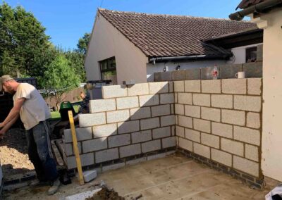 Builder laying blockwork in at a bungalow in Thrapston