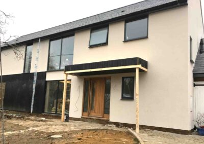 Exterior finished in a combination of render and cladding